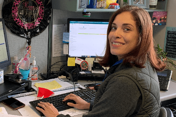A soman working at a desk